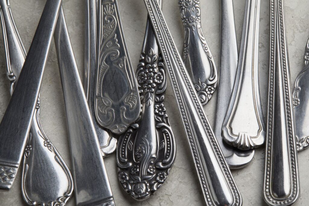 Antique silver forks and spoons with decorative handles