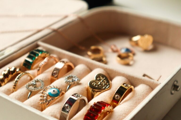 A box filled with gold and gemstone rings