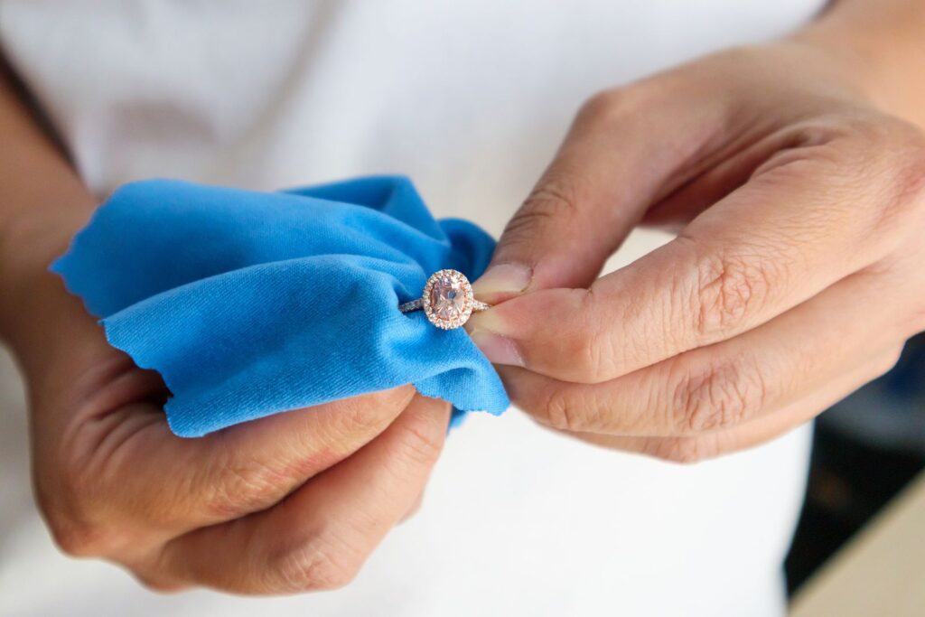 Cleaning a diamond ring with a soft microfibre cloth