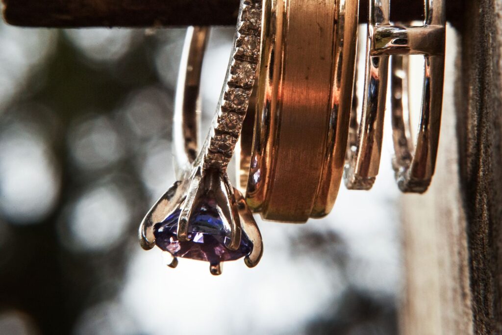 Engagement and wedding rings hanging on a display