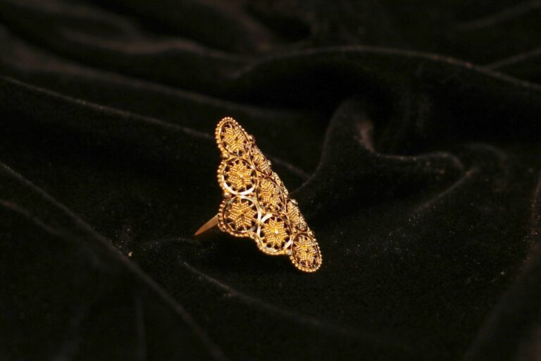 An ornate gold filigree ring