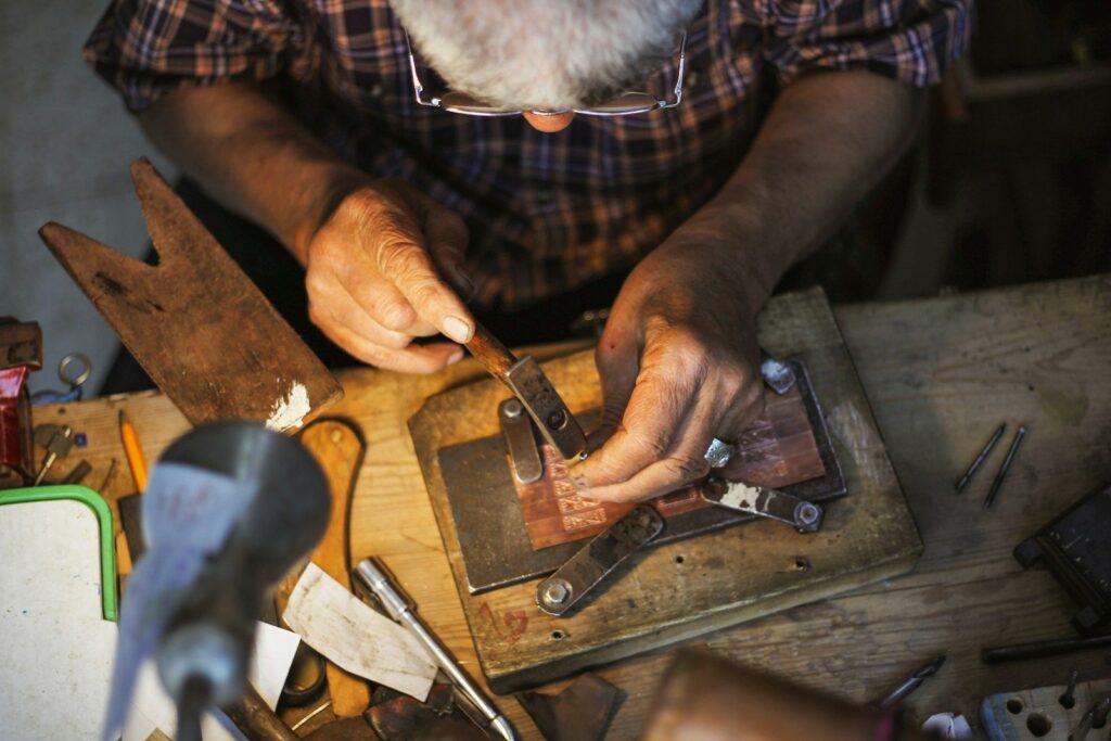 Goldsmith working at a workbench