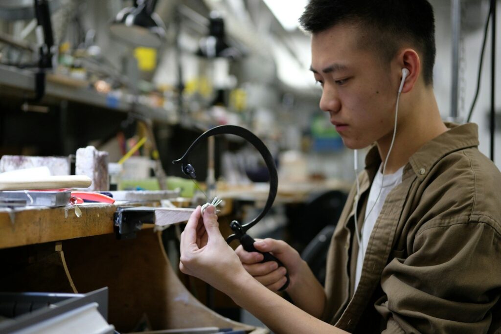 Jeweller working at the bench in a workshop