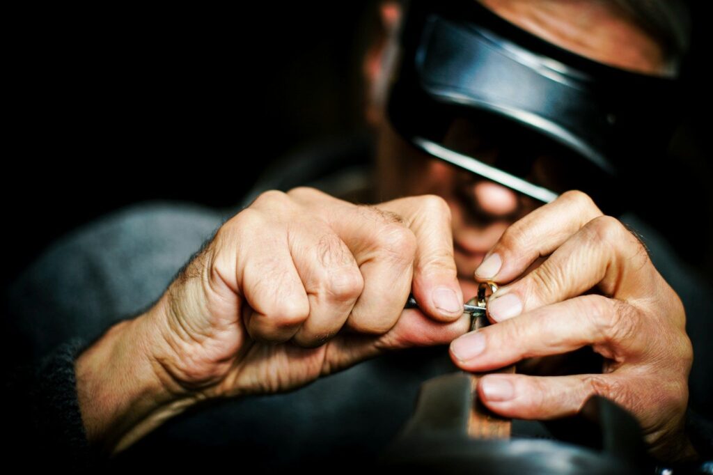 Jeweller inspecting a piece under magnification