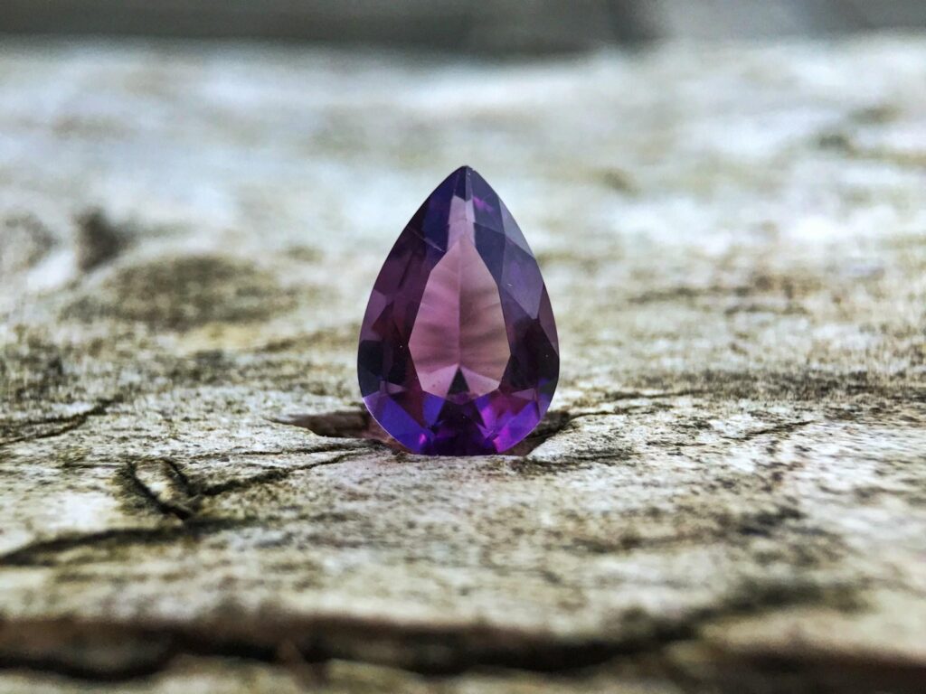A pear-shaped amethyst gemstone