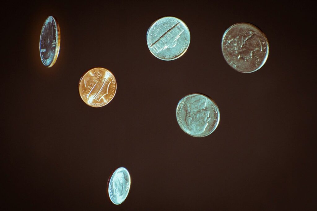 Silver coins on a dark table