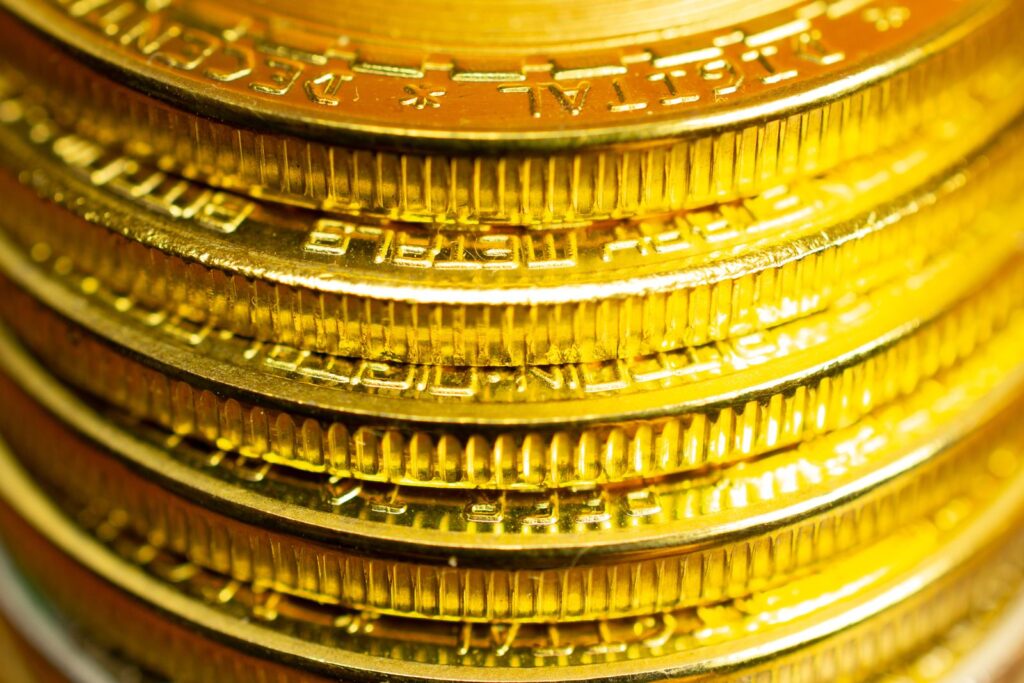 Close-up of stacked coins seen from the edge